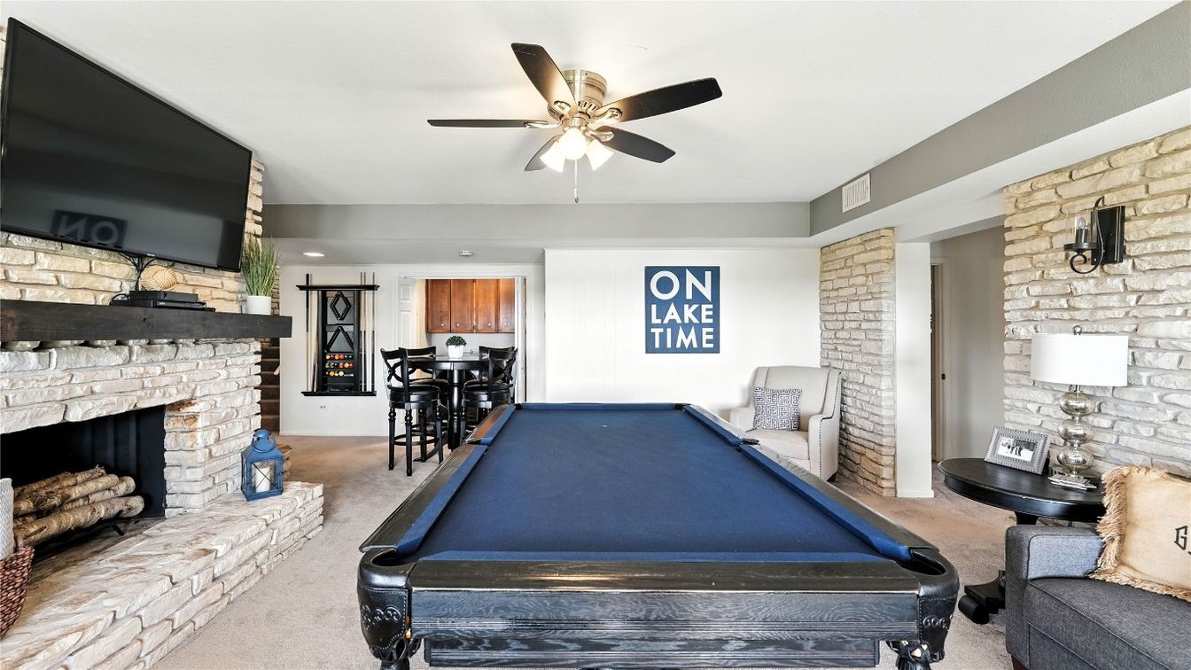 Billiard Table, Fireplace, Fitness Equipment, Game Room, Interior, Recessed Lighting, Stone Walls