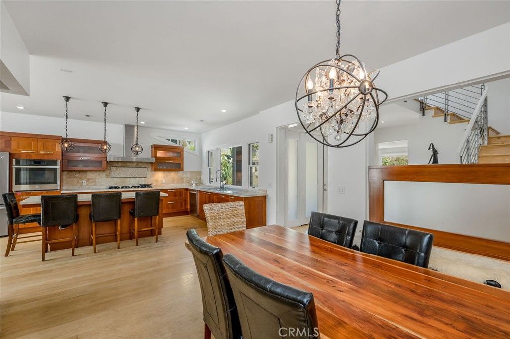Chandelier, Dining room, Interior, Kitchen, Pendant Lights, Recessed Lighting, Stainless Steel Appliances, Wood Texture Flooring