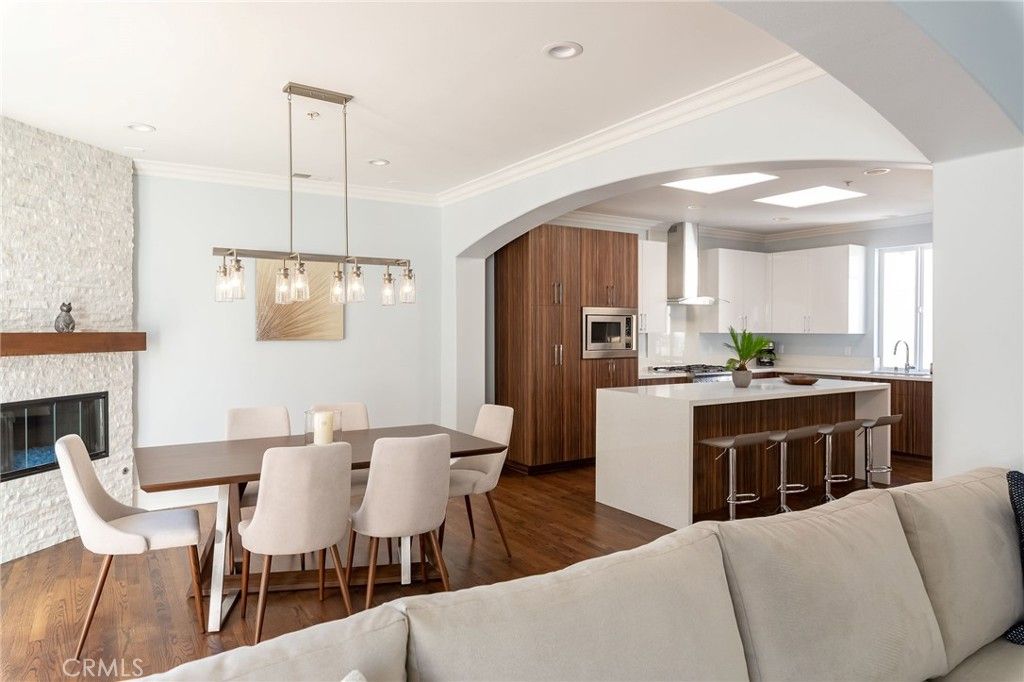 Dining room, Fireplace, Interior, Kitchen, Pendant Lights, Recessed Lighting, Stainless Steel Appliances, Wood Texture Flooring