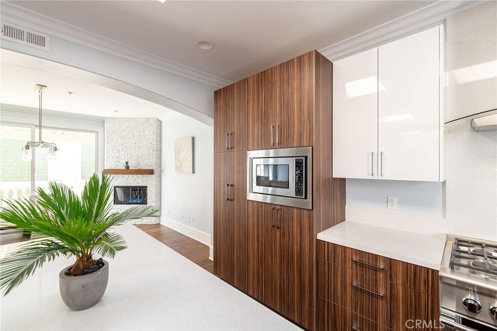 Fireplace, Interior, Kitchen, Pendant Lights, Recessed Lighting, Stainless Steel Appliances, Wood Texture Flooring