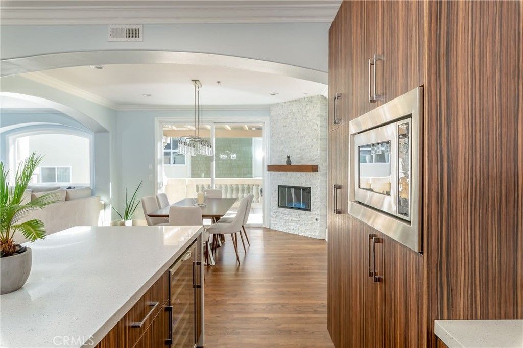 Dining room, Fireplace, Interior, Pendant Lights, Recessed Lighting, Stone Walls, Wood Texture Flooring