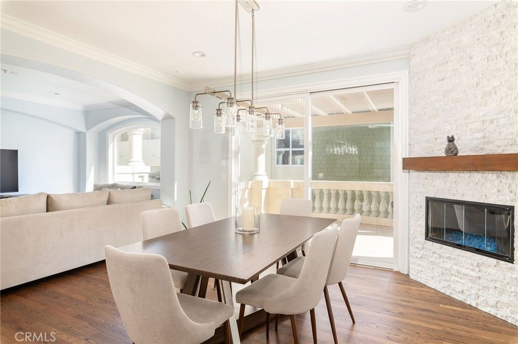 Dining room, Fireplace, Interior, Living room, Pendant Lights, Recessed Lighting, Wood Texture Flooring