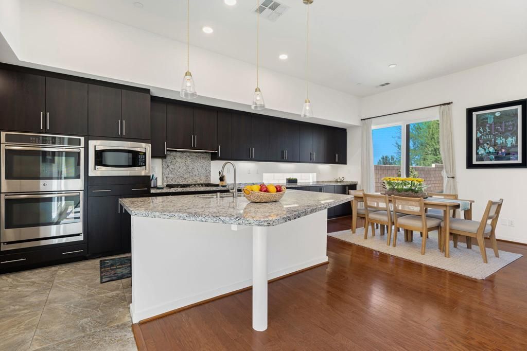 Dining room, Interior, Kitchen, Pendant Lights, Recessed Lighting, Stainless Steel Appliances, Wood Texture Flooring