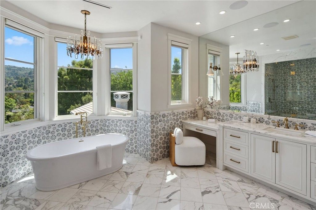 Bathroom, Chandelier, Dual Sink Vanities, Free Standing Baths, Interior, Marble, Marble Walls, Pendant Lights, Recessed Lighting