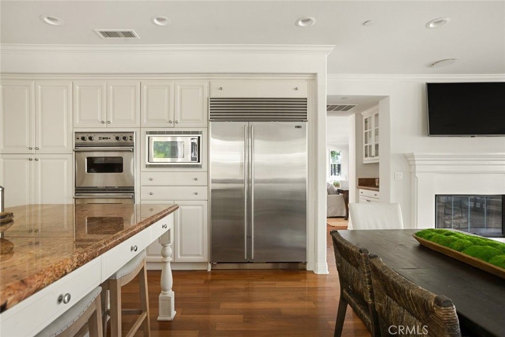 Fireplace, Interior, Kitchen, Recessed Lighting, Stainless Steel Appliances, Wood Texture Flooring
