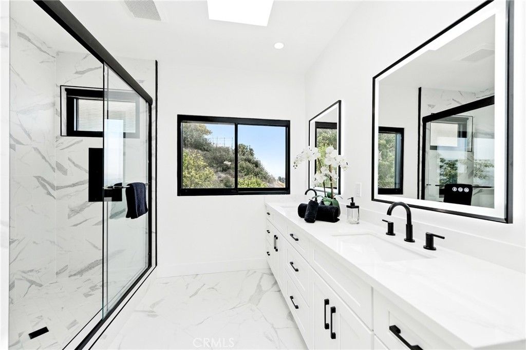 Bathroom, Dual Sink Vanities, Glass Shower, Interior, Marble, Marble Walls, Recessed Lighting