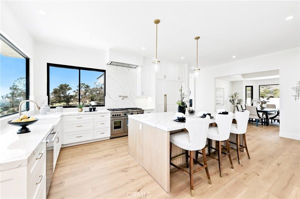 Dining room, Interior, Kitchen, Marble Walls, Pendant Lights, Recessed Lighting, Stainless Steel Appliances, Wood Texture Flooring
