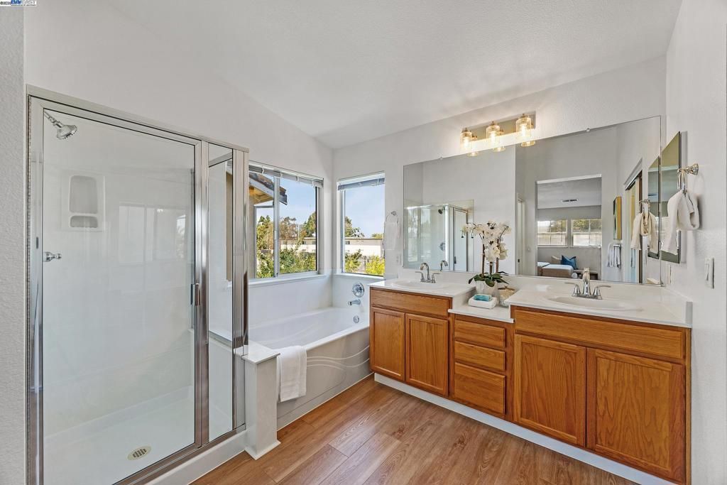 Bathroom, Dual Sink Vanities, Glass Shower, Interior, Wood Texture Flooring