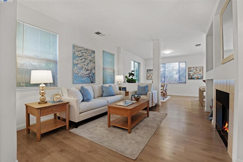 Dining room, Fireplace, Interior, Living room, Recessed Lighting, Wood Texture Flooring