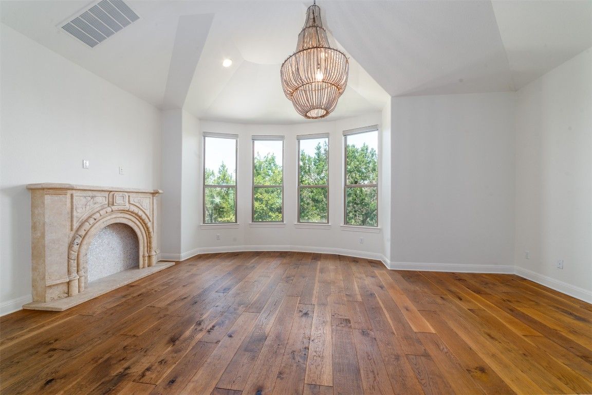 Chandelier, Empty room, Fireplace, Interior, Recessed Lighting, Wood Texture Flooring