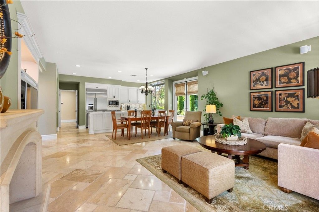 Chandelier, Dining room, Fireplace, Interior, Kitchen, Living room, Pendant Lights, Recessed Lighting, Stainless Steel Appliances