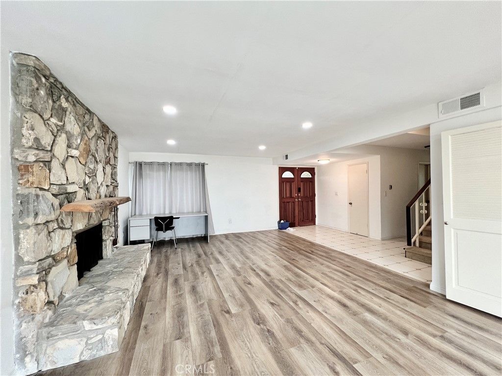Empty room, Fireplace, Interior, Recessed Lighting, Stone Walls, Wood Texture Flooring