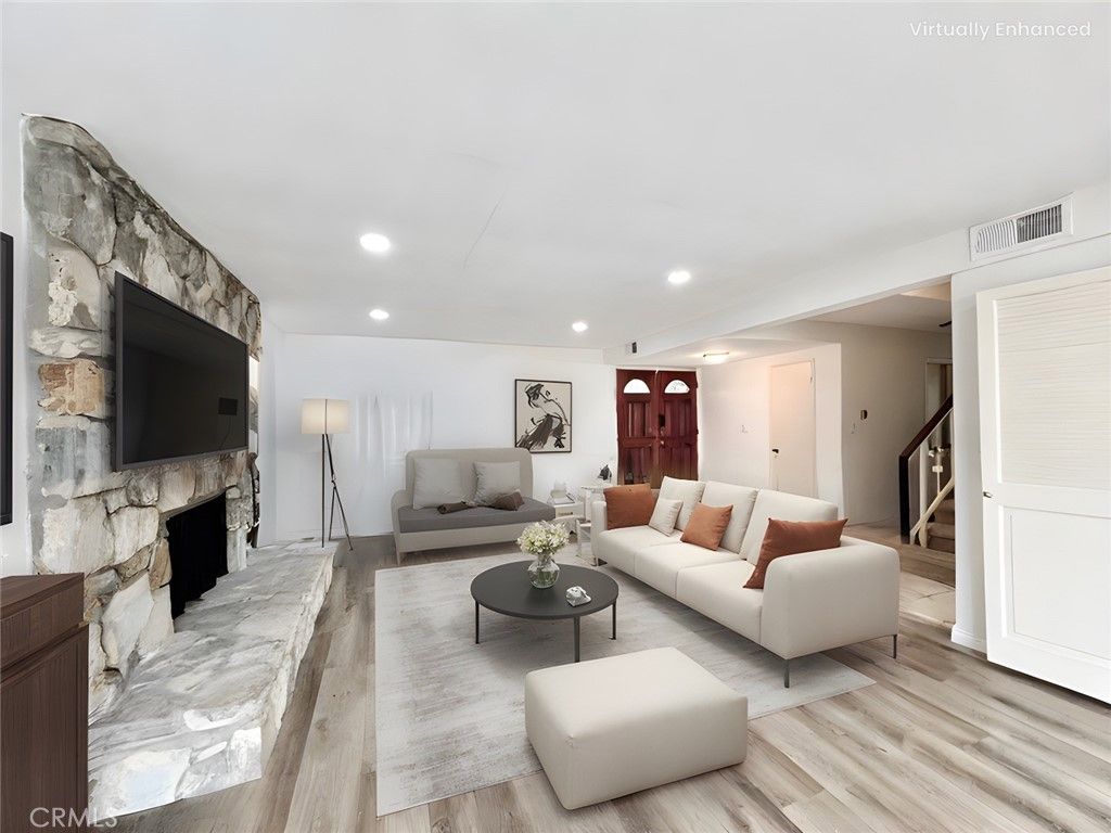 Fireplace, Interior, Living room, Recessed Lighting, Stone Walls, Wood Texture Flooring