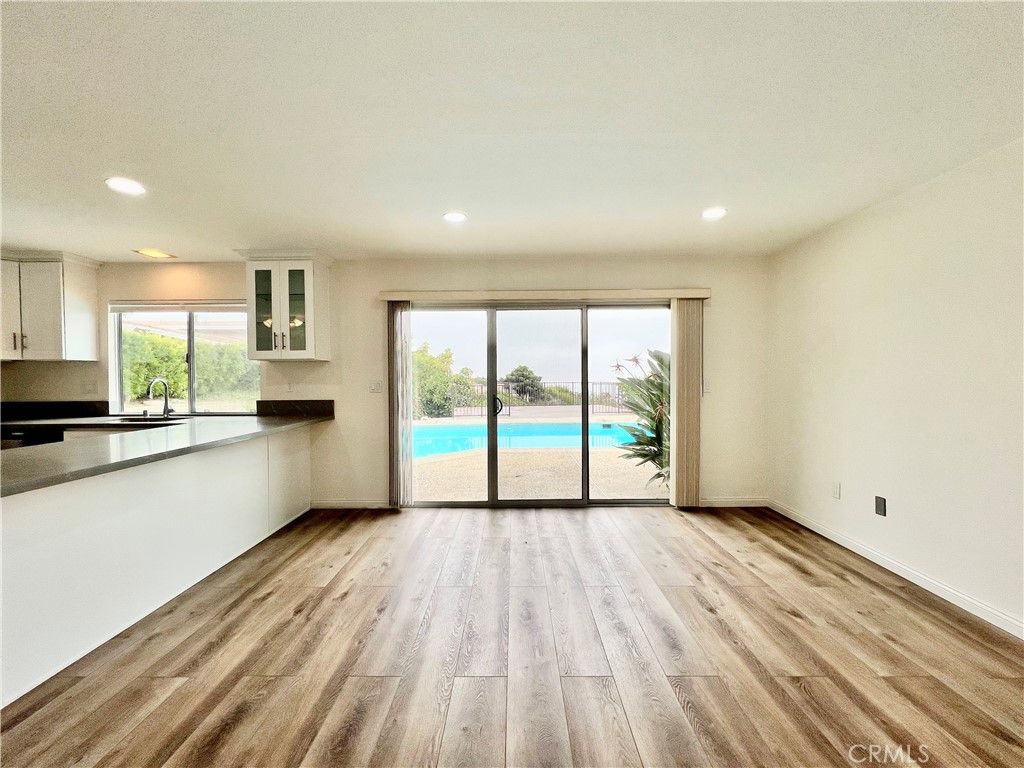 Empty room, Interior, Kitchen, Recessed Lighting, Water, Wood Texture Flooring