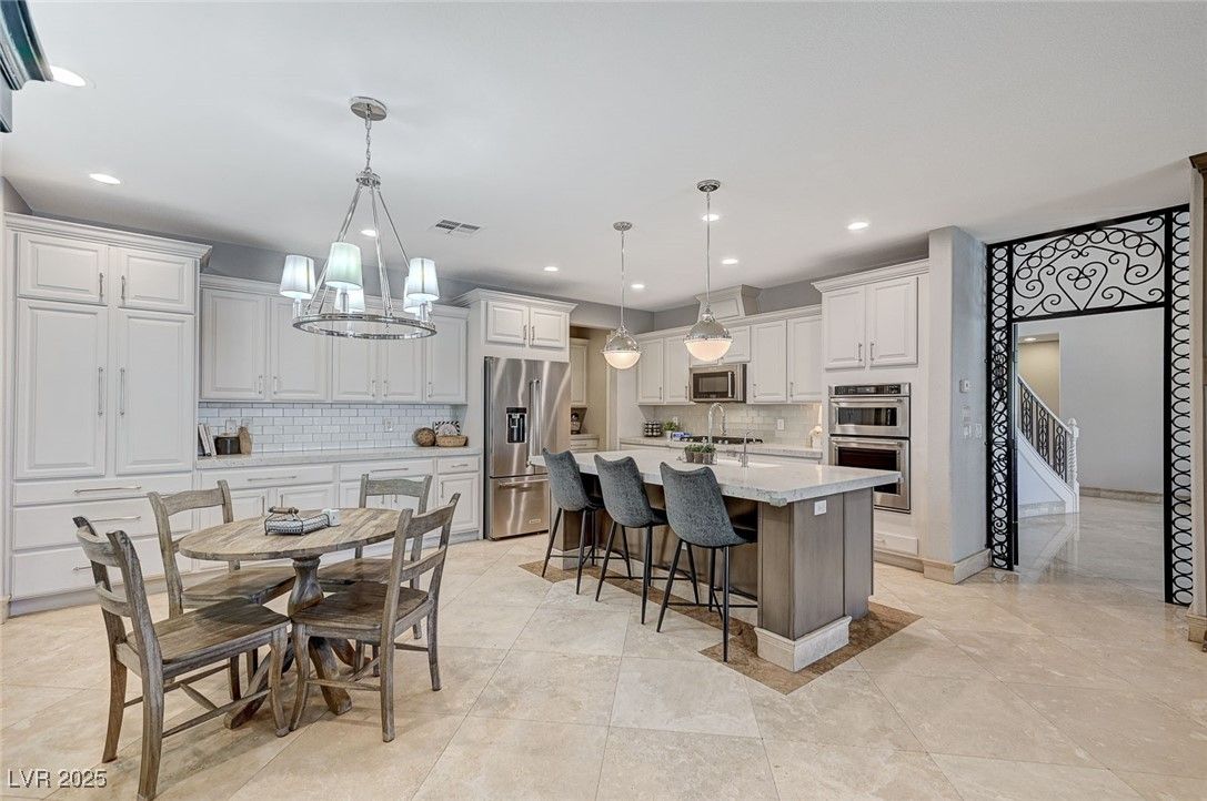 Chandelier, Dining room, Interior, Kitchen, Pendant Lights, Recessed Lighting, Stainless Steel Appliances