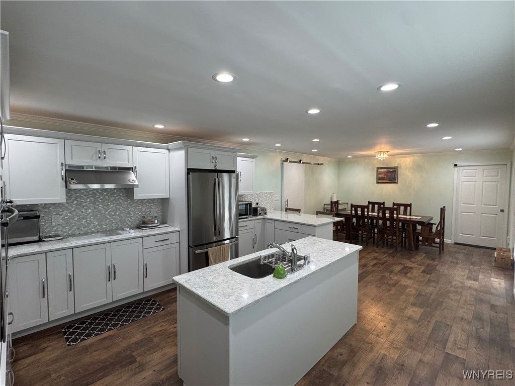 Dining room, Interior, Kitchen, Recessed Lighting, Stainless Steel Appliances, Wood Texture Flooring