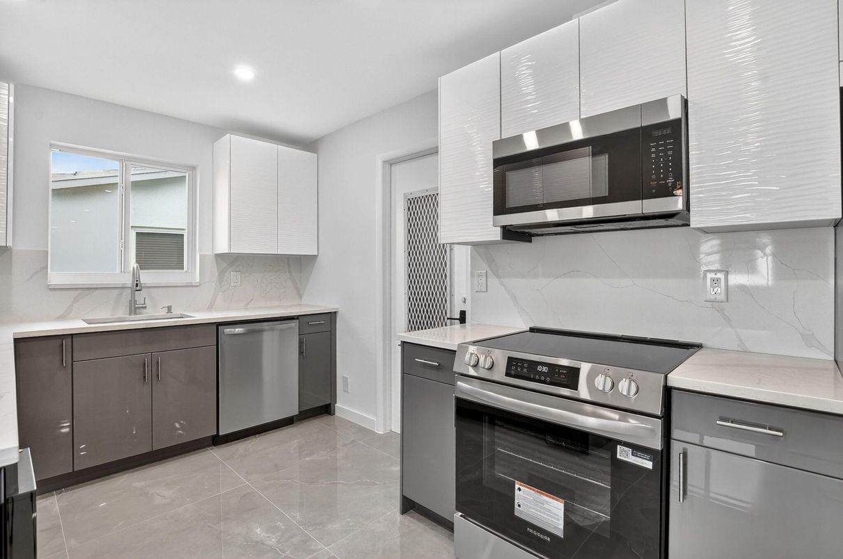 Interior, Kitchen, Marble Walls, Recessed Lighting, Stainless Steel Appliances