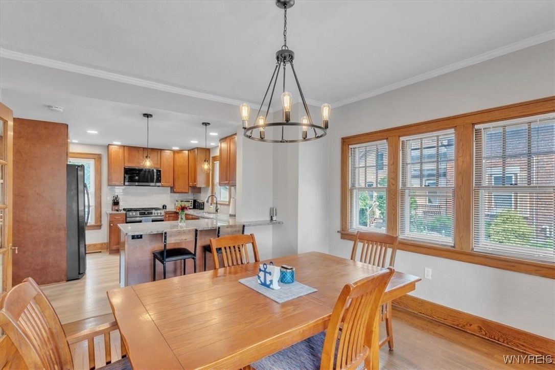 Chandelier, Dining room, Interior, Kitchen, Pendant Lights, Recessed Lighting, Stainless Steel Appliances, Wood Texture Flooring