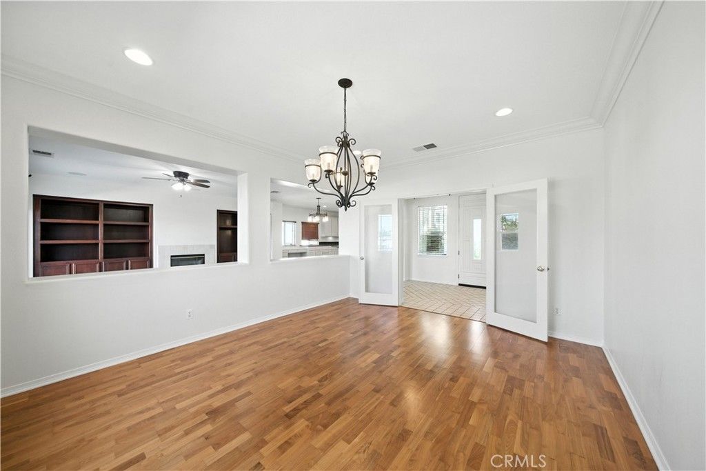 Chandelier, Empty room, Fireplace, Interior, Pendant Lights, Recessed Lighting, Wood Texture Flooring