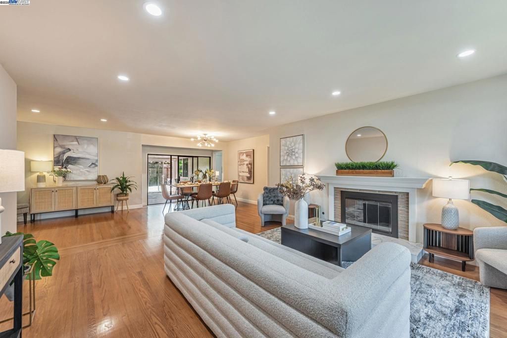 Dining room, Fireplace, Interior, Living room, Recessed Lighting, Wood Texture Flooring