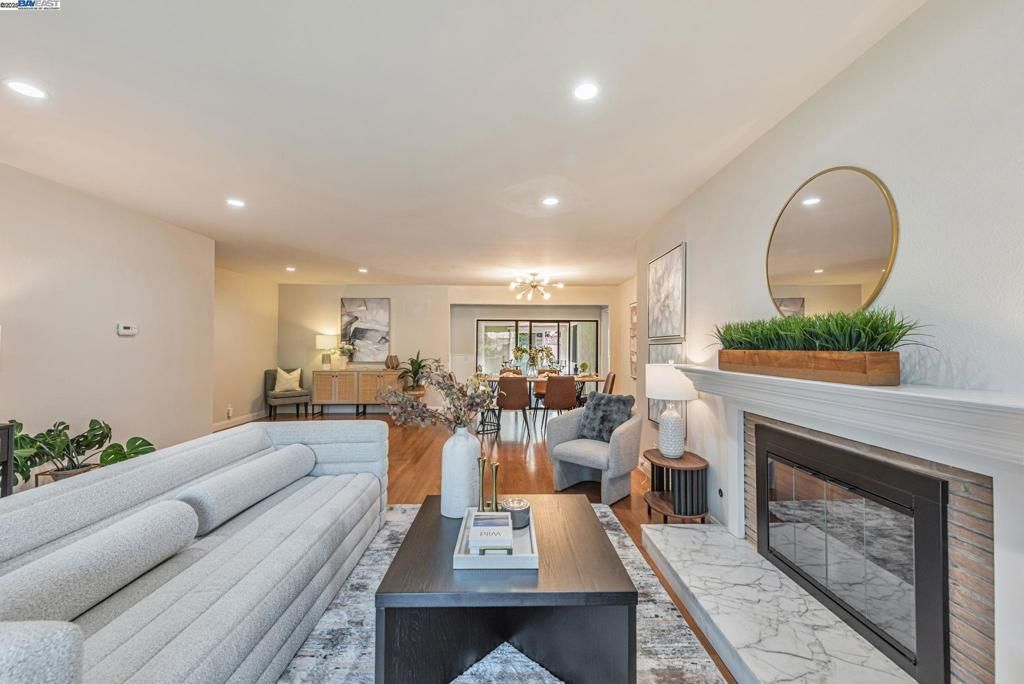 Dining room, Fireplace, Interior, Living room, Recessed Lighting, Wood Texture Flooring