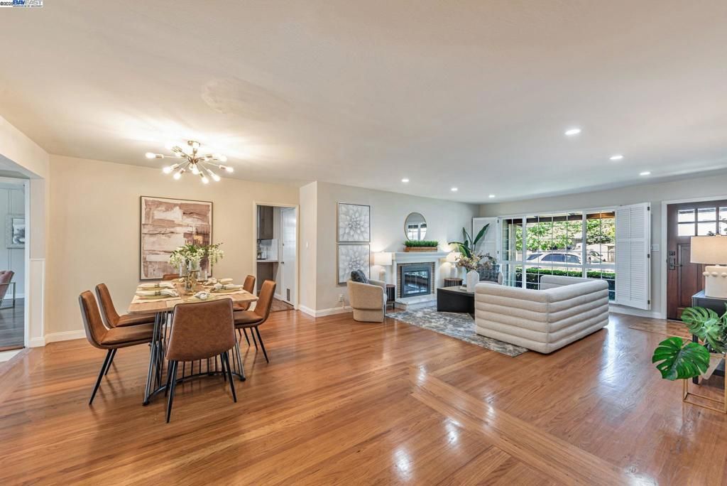Dining room, Fireplace, Interior, Living room, Pendant Lights, Recessed Lighting, Wood Texture Flooring