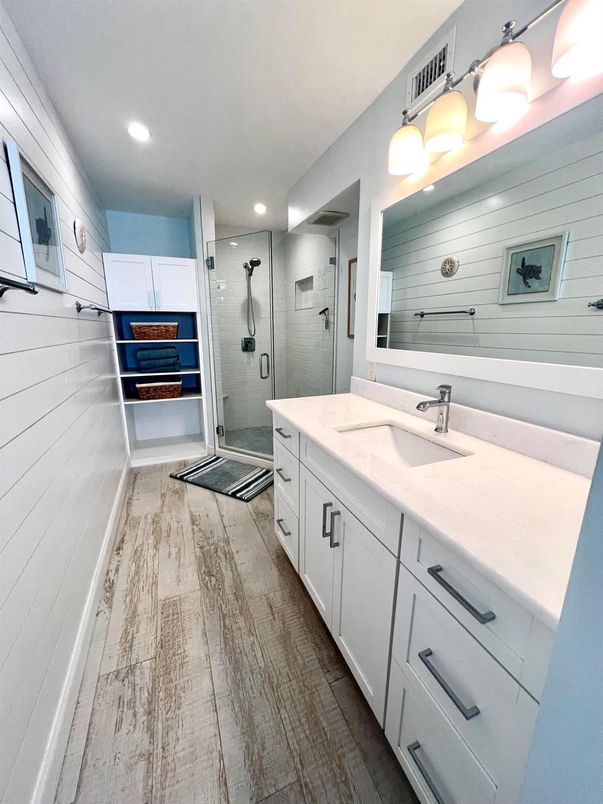 Bathroom, Dual Sink Vanities, Glass Shower, Interior, Recessed Lighting, Wood Texture Flooring