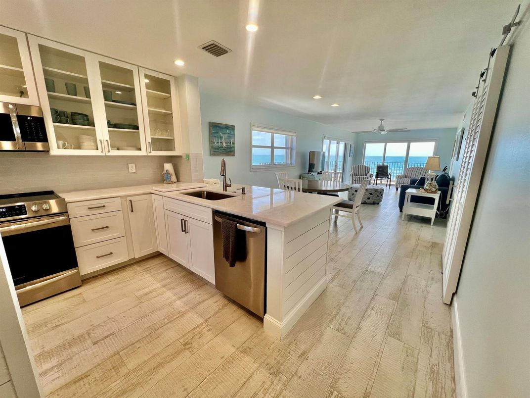 Dining room, Interior, Kitchen, Recessed Lighting, Stainless Steel Appliances, Water, Wood Texture Flooring