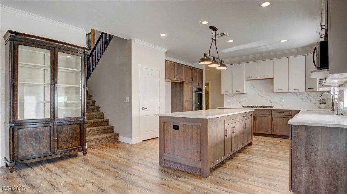 Interior, Kitchen, Marble Walls, Pendant Lights, Recessed Lighting, Stainless Steel Appliances, Wood Texture Flooring