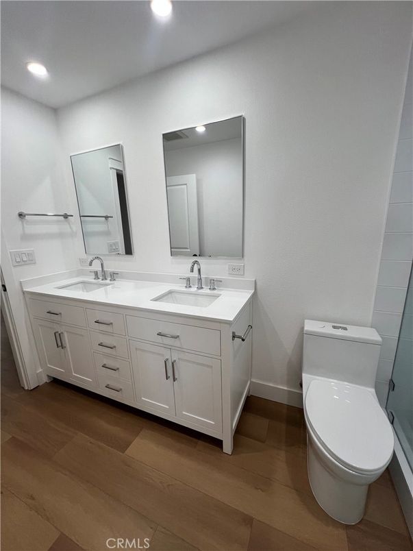 Bathroom, Dual Sink Vanities, Interior, Recessed Lighting, Wood Texture Flooring