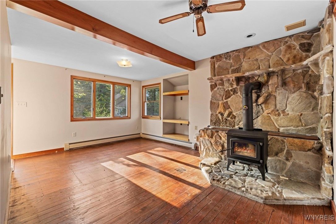 Empty room, Fireplace, Interior, Stone Walls, Wooden Beams, Wood Texture Flooring