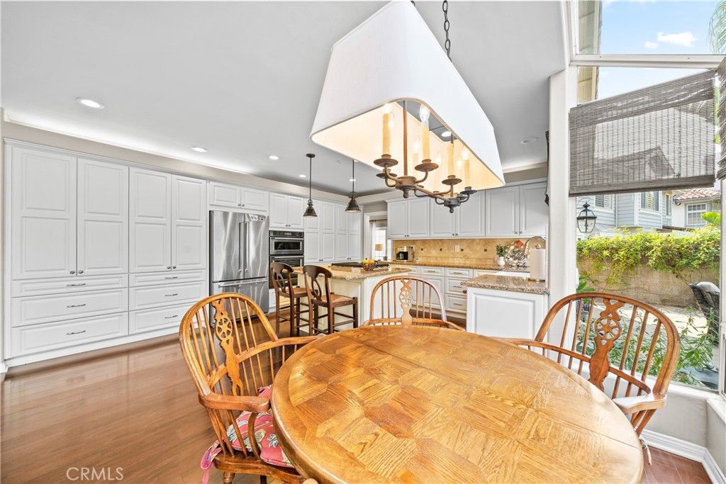 Chandelier, Dining room, Interior, Kitchen, Pendant Lights, Recessed Lighting, Stainless Steel Appliances, Wood Texture Flooring