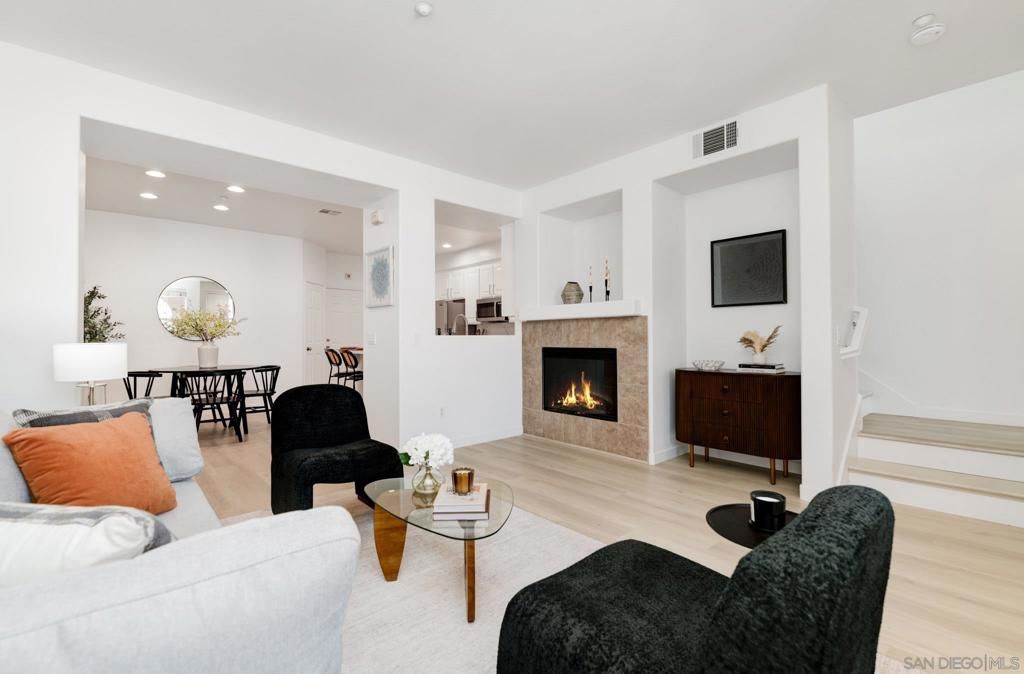 Dining room, Fireplace, Interior, Living room, Recessed Lighting, Wood Texture Flooring
