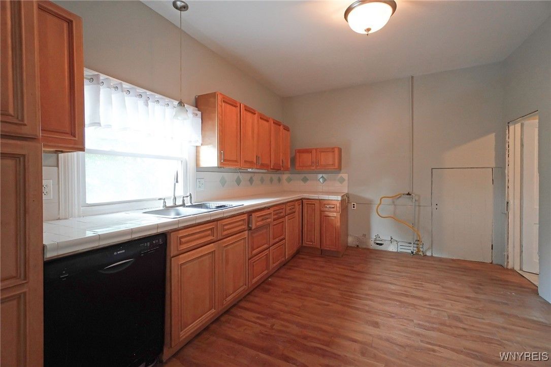 Interior, Kitchen, Tile Countertops, Wood Texture Flooring