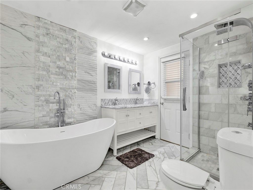 Bathroom, Dual Sink Vanities, Free Standing Baths, Glass Shower, Interior, Marble, Marble Walls, Recessed Lighting