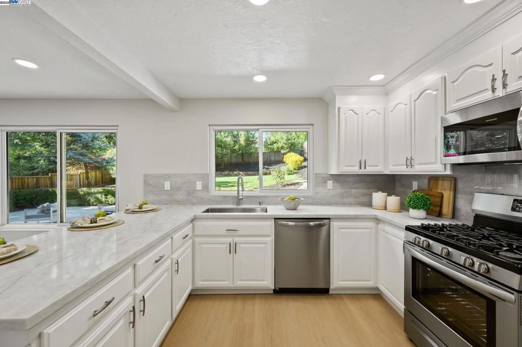 Interior, Kitchen, Recessed Lighting, Stainless Steel Appliances, Wood Texture Flooring