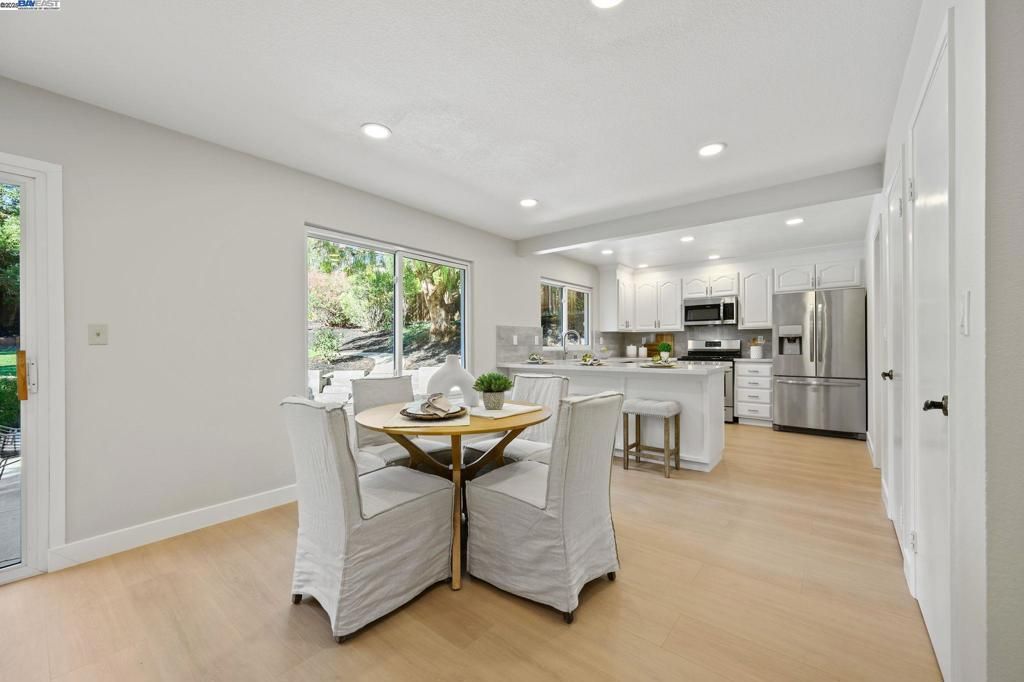 Dining room, Interior, Kitchen, Recessed Lighting, Stainless Steel Appliances, Wood Texture Flooring