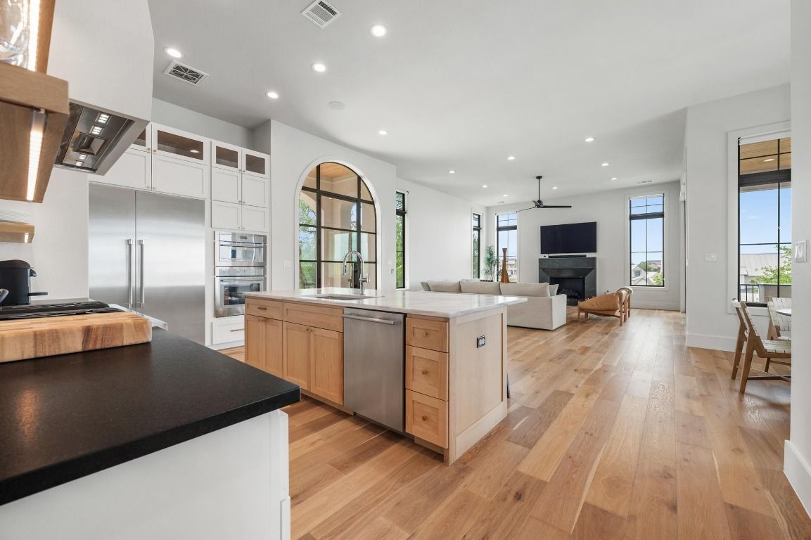Fireplace, Interior, Kitchen, Living room, Recessed Lighting, Stainless Steel Appliances, Wood Texture Flooring