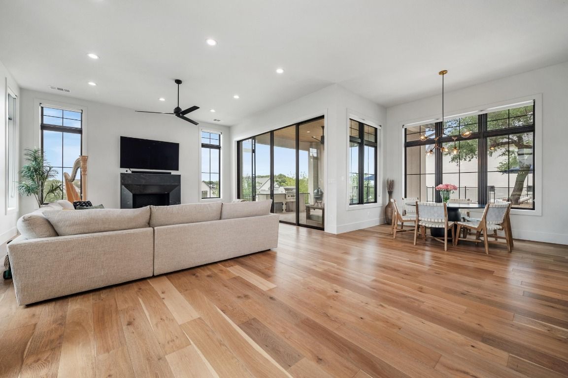Dining room, Fireplace, Interior, Living room, Pendant Lights, Recessed Lighting, Wood Texture Flooring