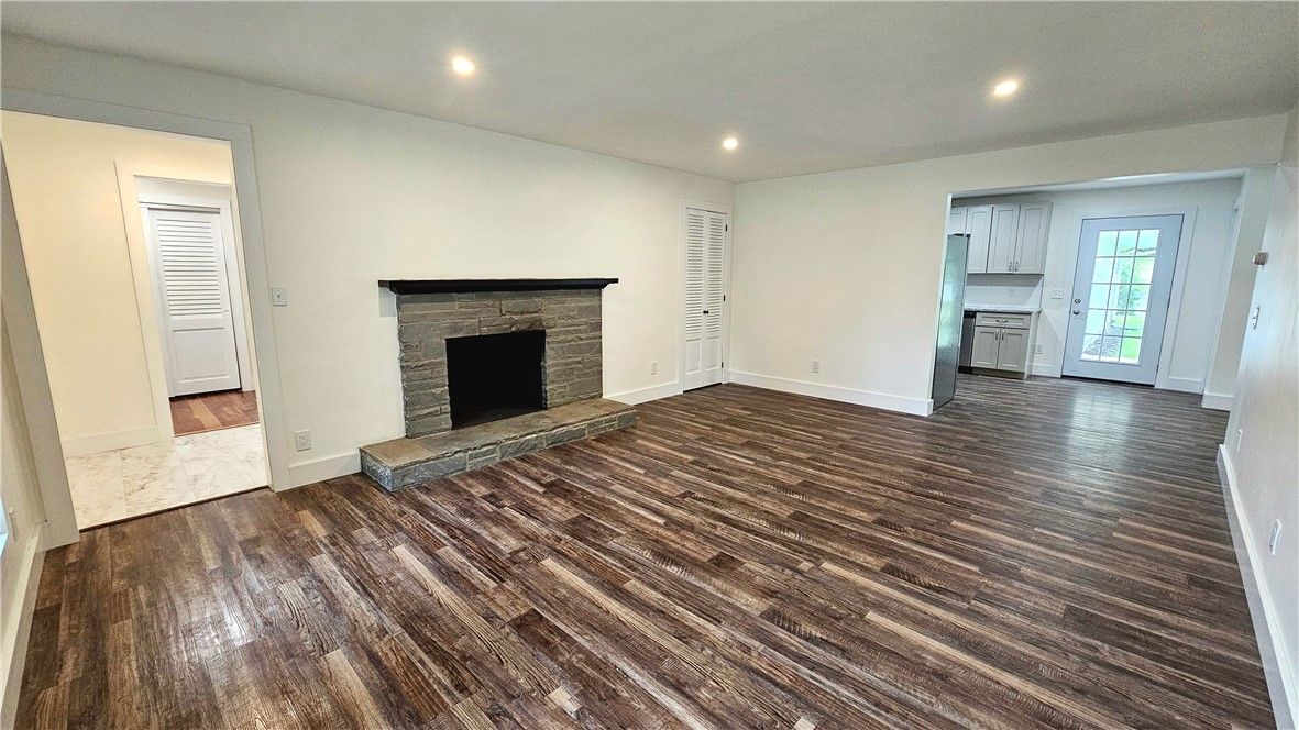 Empty room, Fireplace, Interior, Kitchen, Recessed Lighting, Wood Texture Flooring