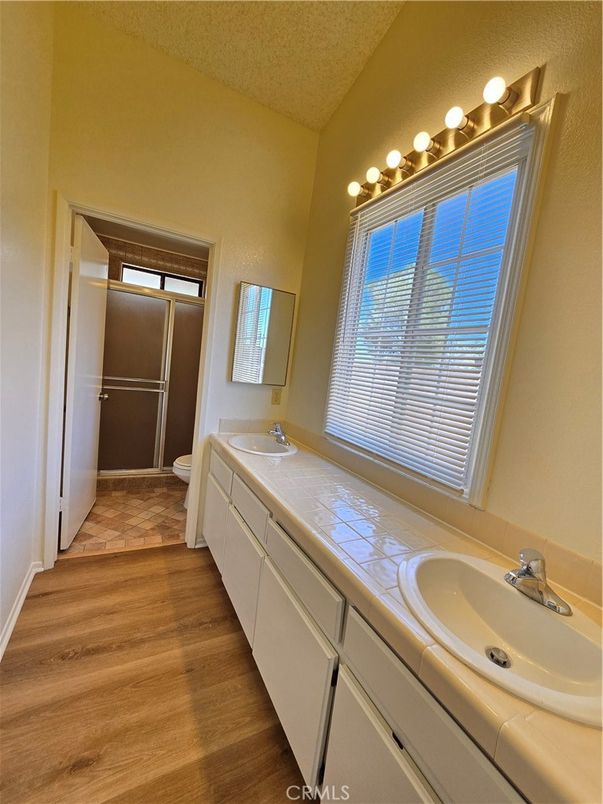 Bathroom, Dual Sink Vanities, Interior, Tile Countertops, Wood Texture Flooring