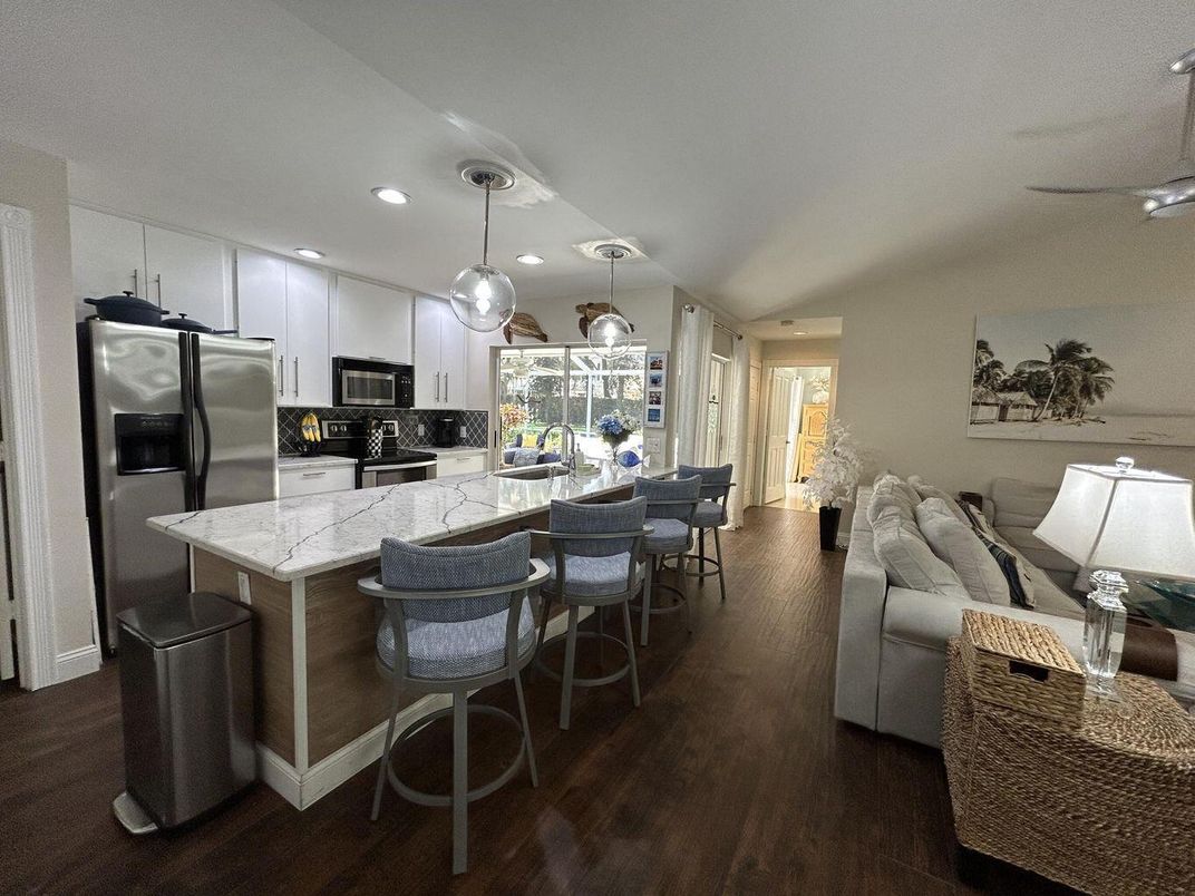 Dining room, Interior, Kitchen, Living room, Pendant Lights, Recessed Lighting, Stainless Steel Appliances, Wood Texture Flooring