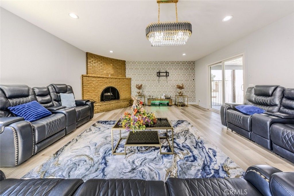 Chandelier, Fireplace, Interior, Living room, Recessed Lighting, Wood Texture Flooring