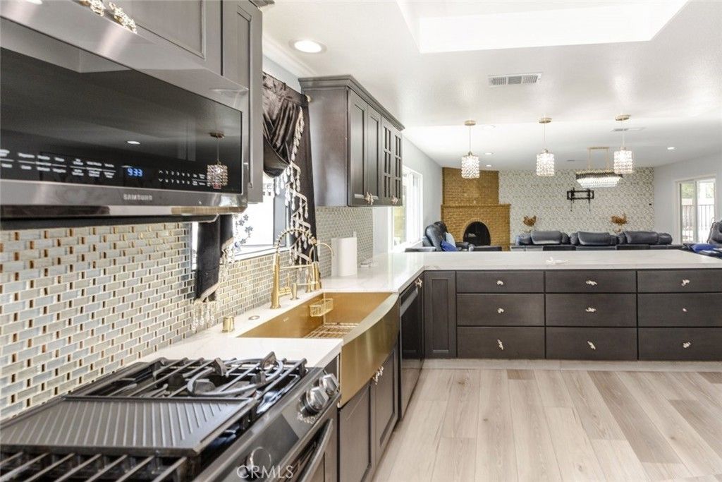 Fireplace, Interior, Kitchen, Pendant Lights, Recessed Lighting, Stainless Steel Appliances, Wood Texture Flooring