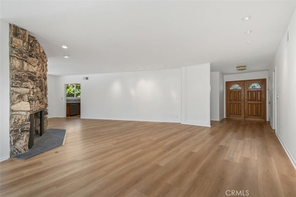 Empty room, Fireplace, Interior, Recessed Lighting, Stone Walls, Wood Texture Flooring