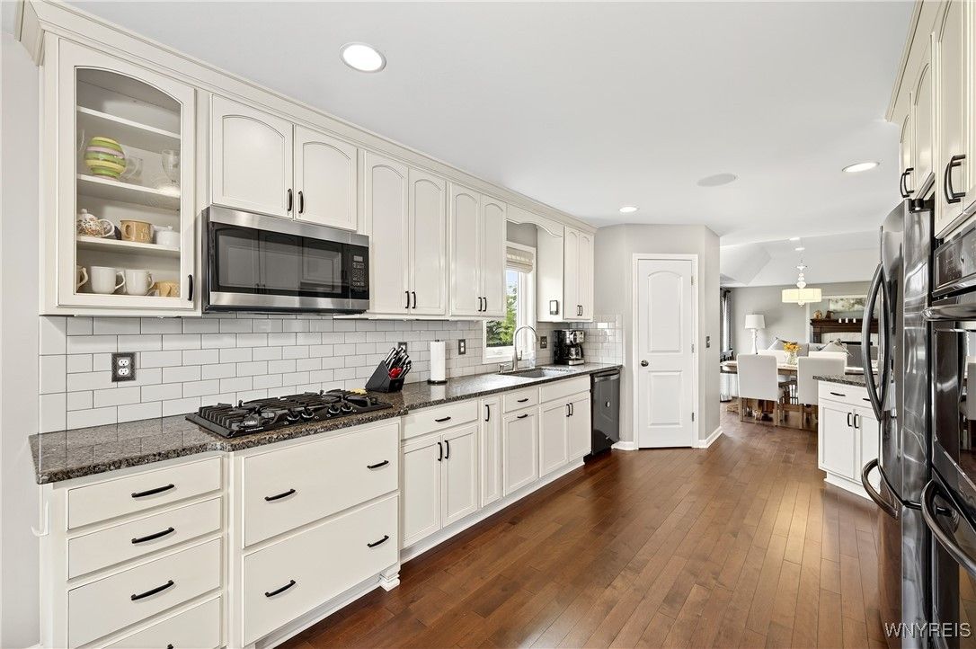 Dining room, Interior, Kitchen, Recessed Lighting, Stainless Steel Appliances, Wood Texture Flooring