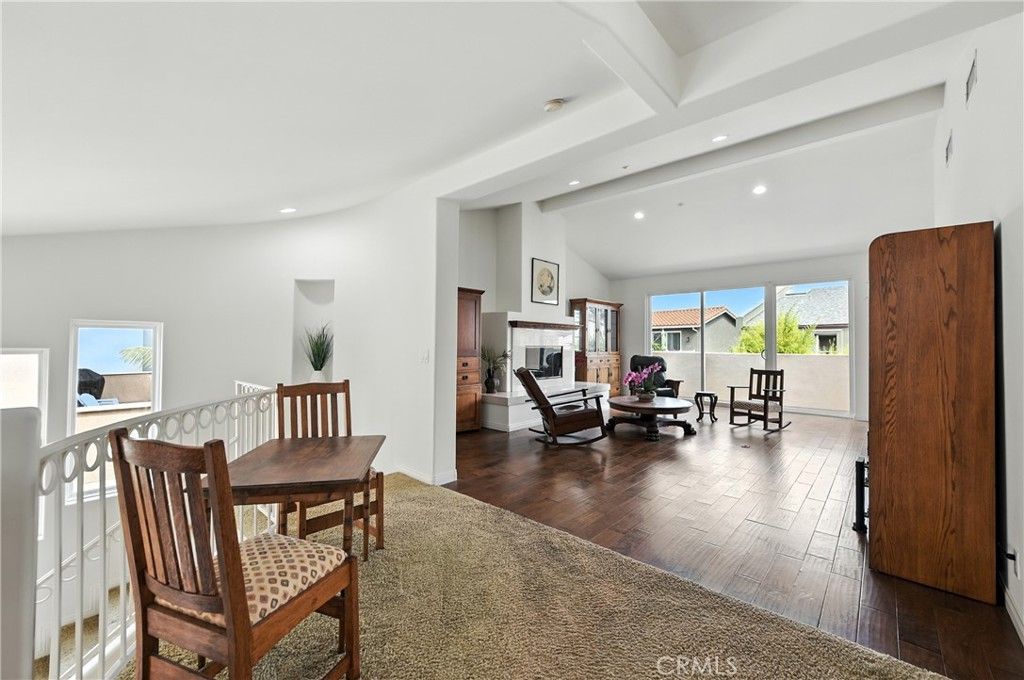 Dining room, Fireplace, Interior, Living room, Recessed Lighting, Wood Texture Flooring