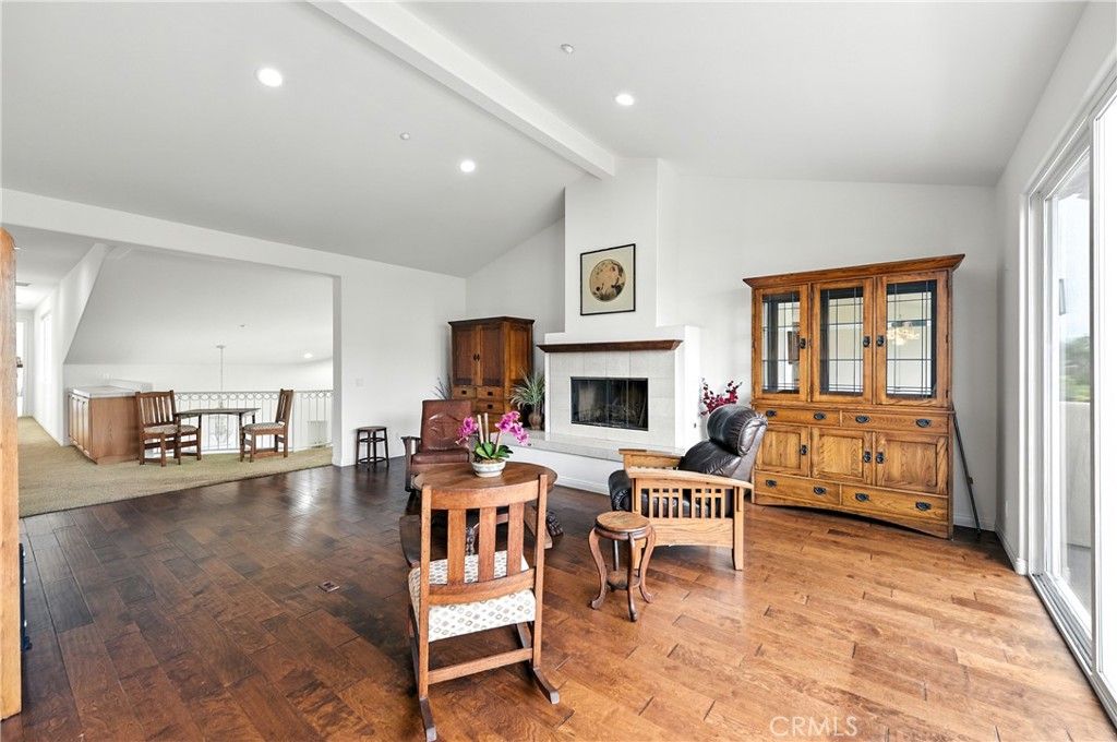 Dining room, Fireplace, Interior, Living room, Recessed Lighting, Wood Texture Flooring