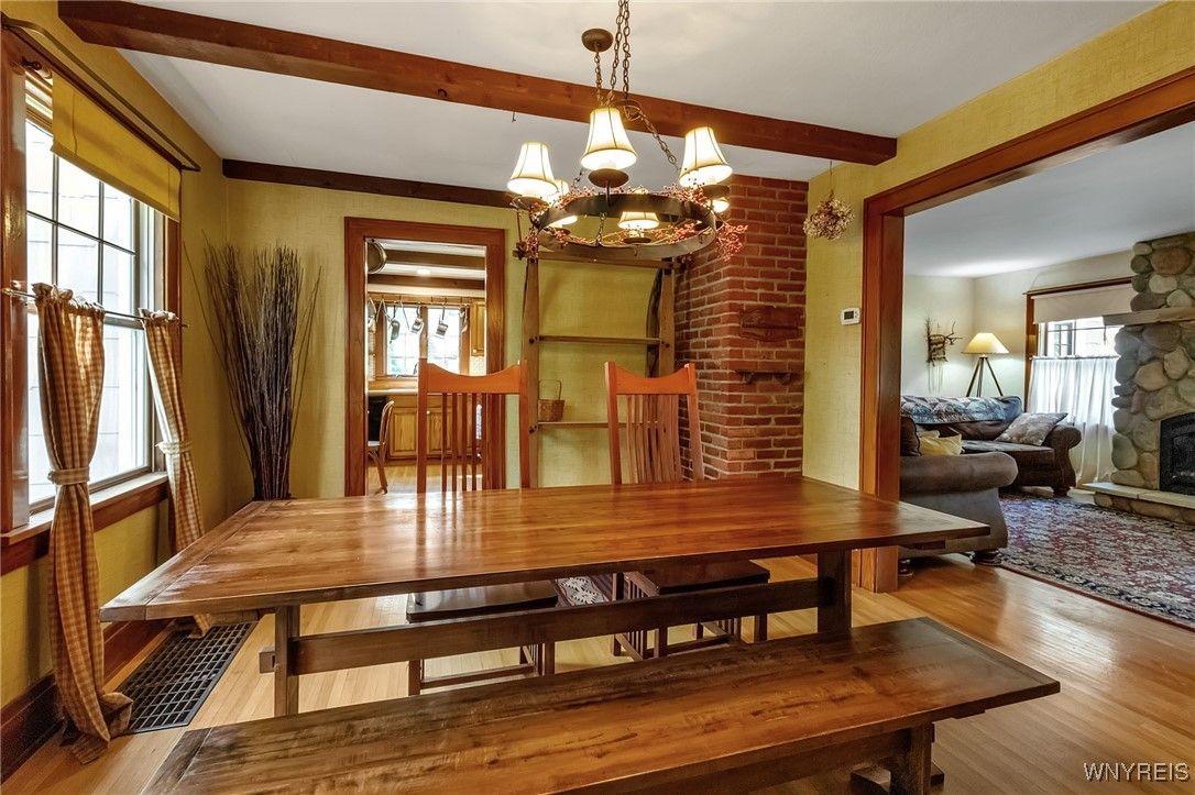 Chandelier, Dining room, Fireplace, Interior, Stone Walls, Wooden Beams, Wood Texture Flooring