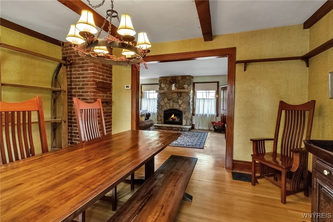 Chandelier, Dining room, Fireplace, Interior, Stone Walls, Wooden Beams, Wood Texture Flooring
